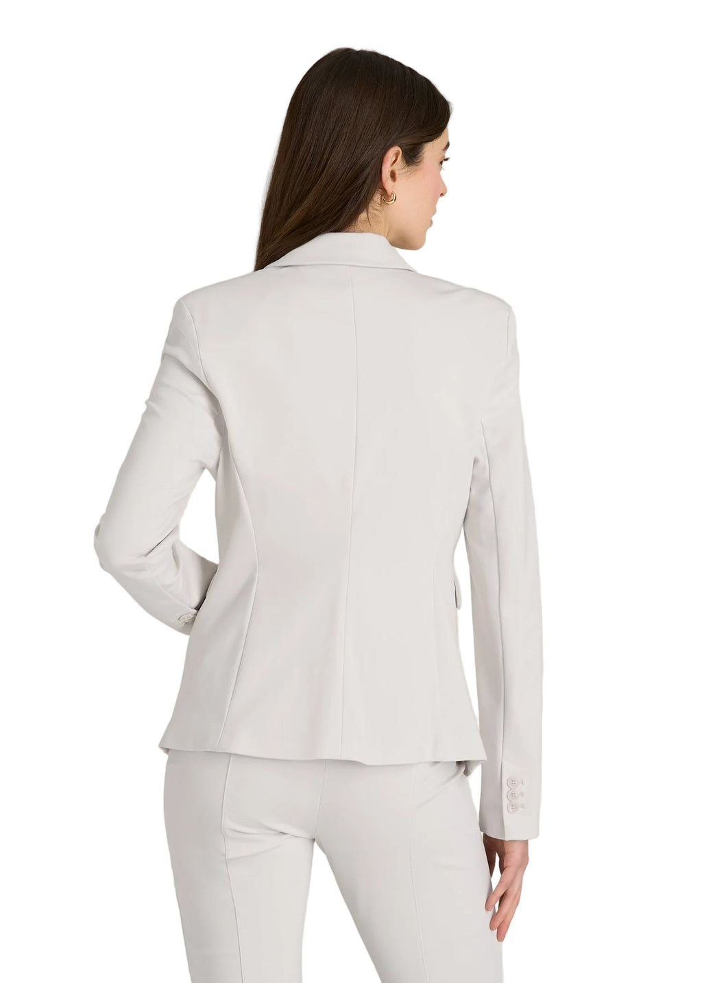 Woman wearing a light gray suit on a white background