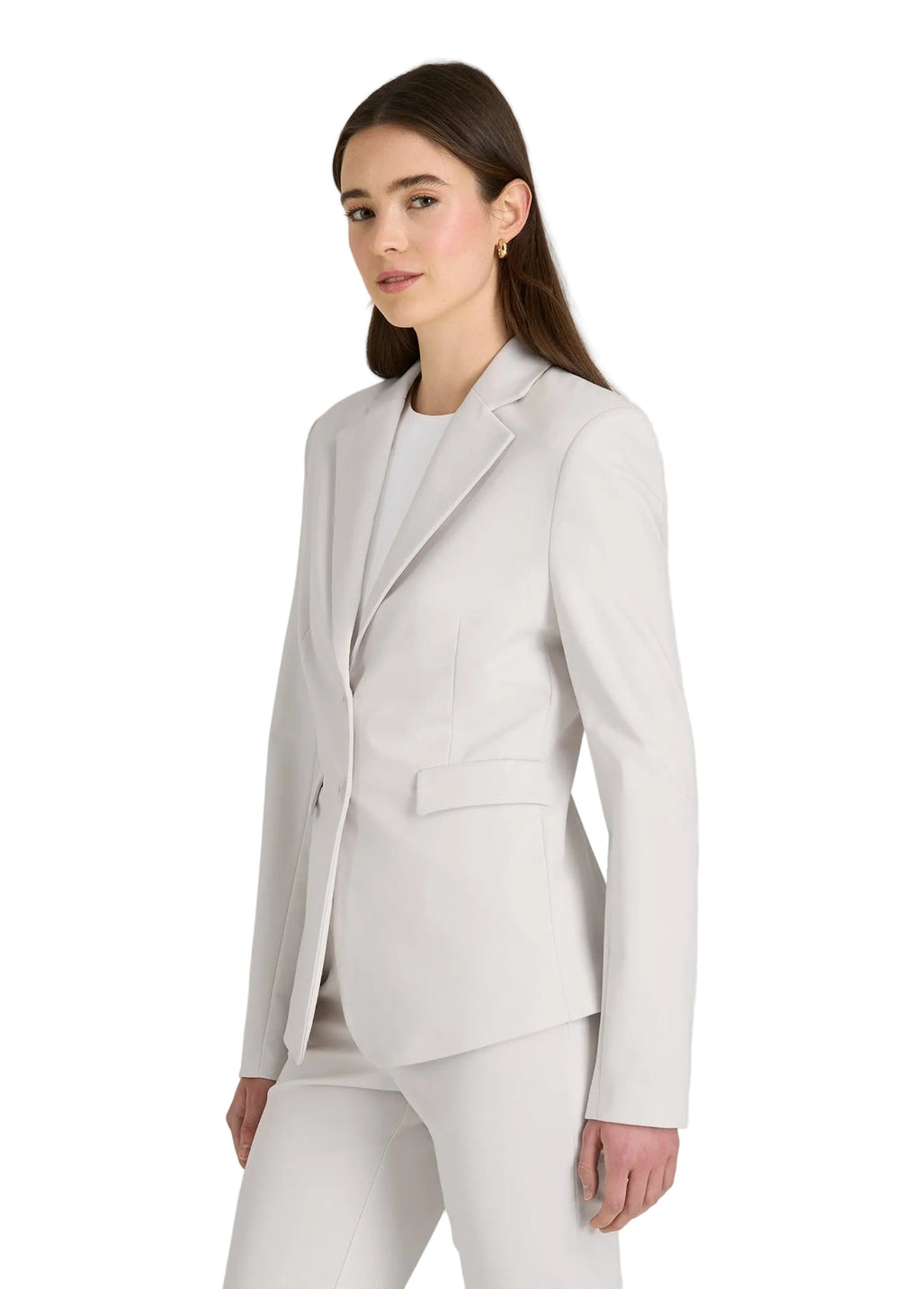 Woman wearing a light gray suit on a white background