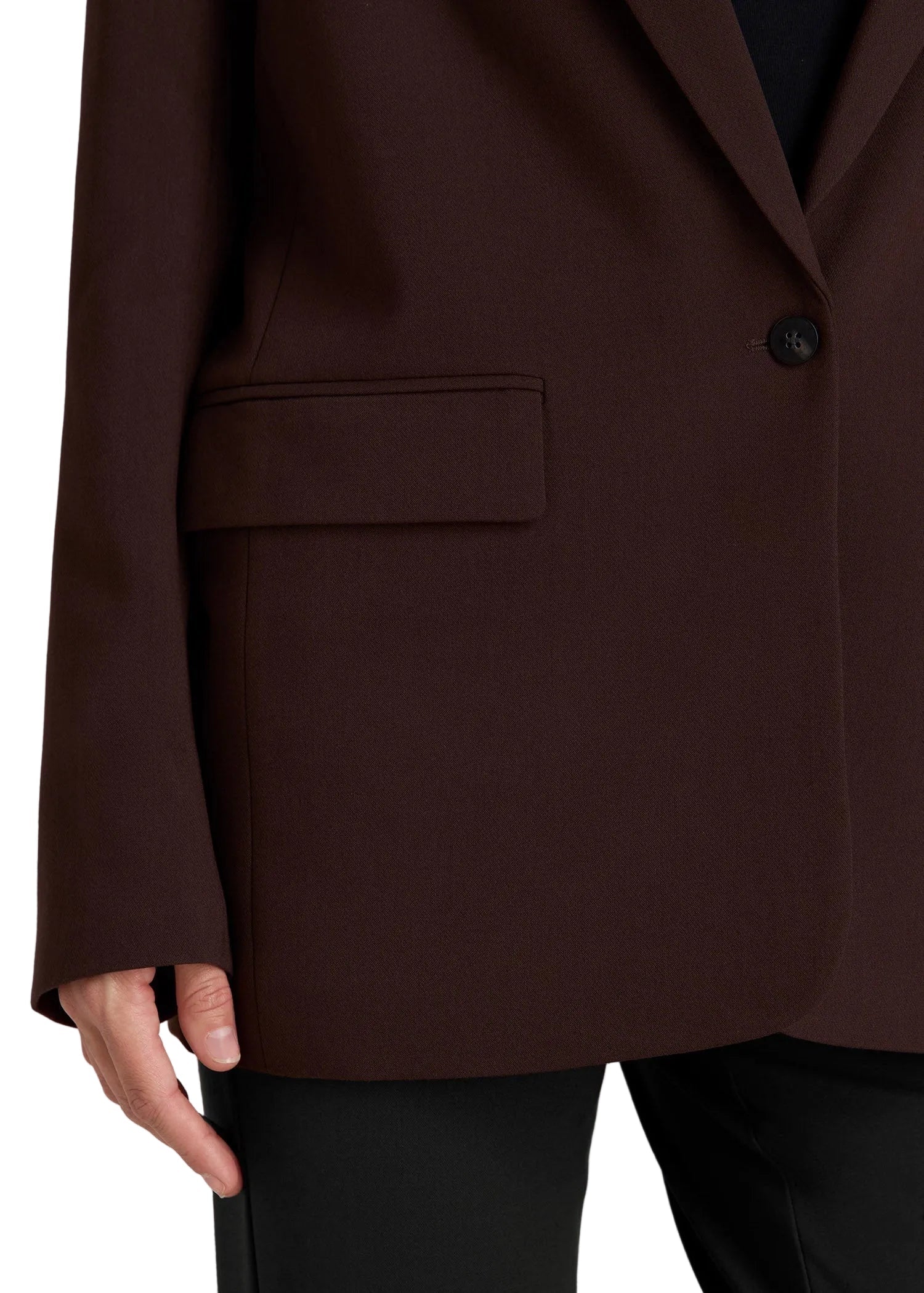 Brown blazer with a pocket and button on a light gray background