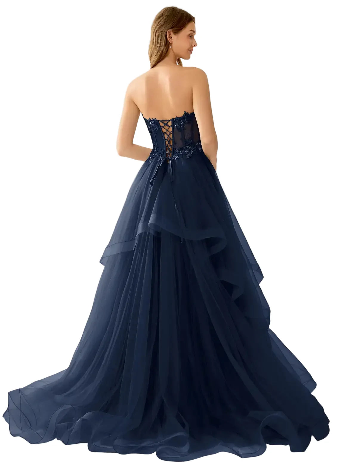 Navy blue evening gown with lace detailing on a plain background