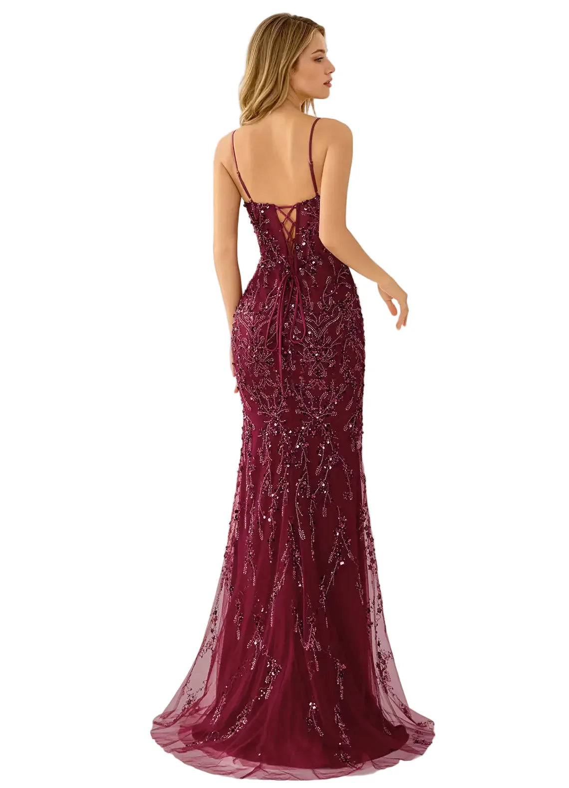 Woman wearing a burgundy evening gown with a sheer overlay on a white background