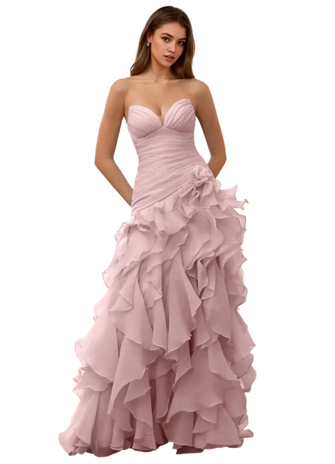 Woman wearing a pink strapless gown with ruffled layers in a bright room.