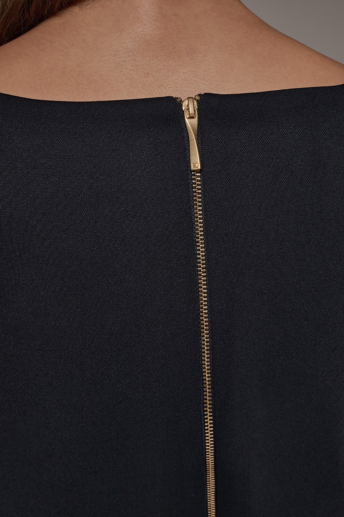 SLEEVELESS PEPLUM BLOUSE