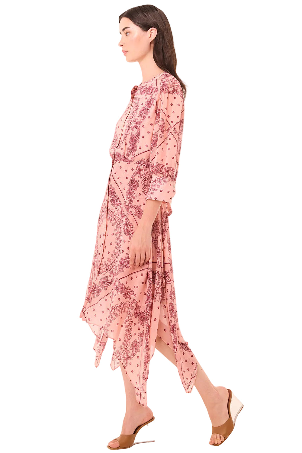 Woman wearing a pink floral dress on a white background
