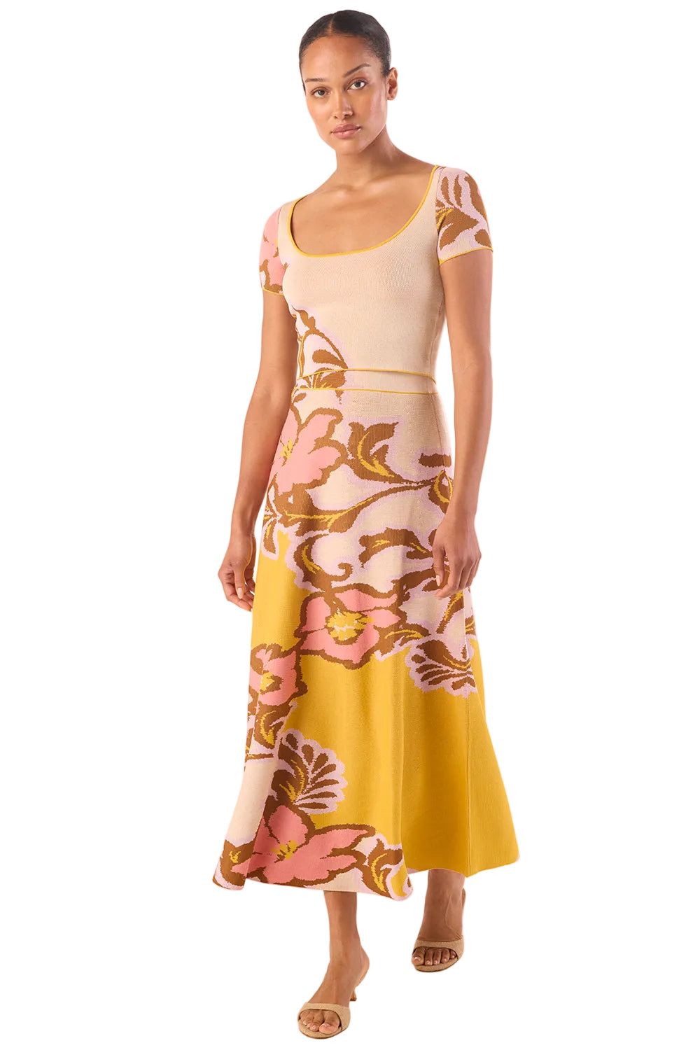 Woman wearing a floral dress with a white background