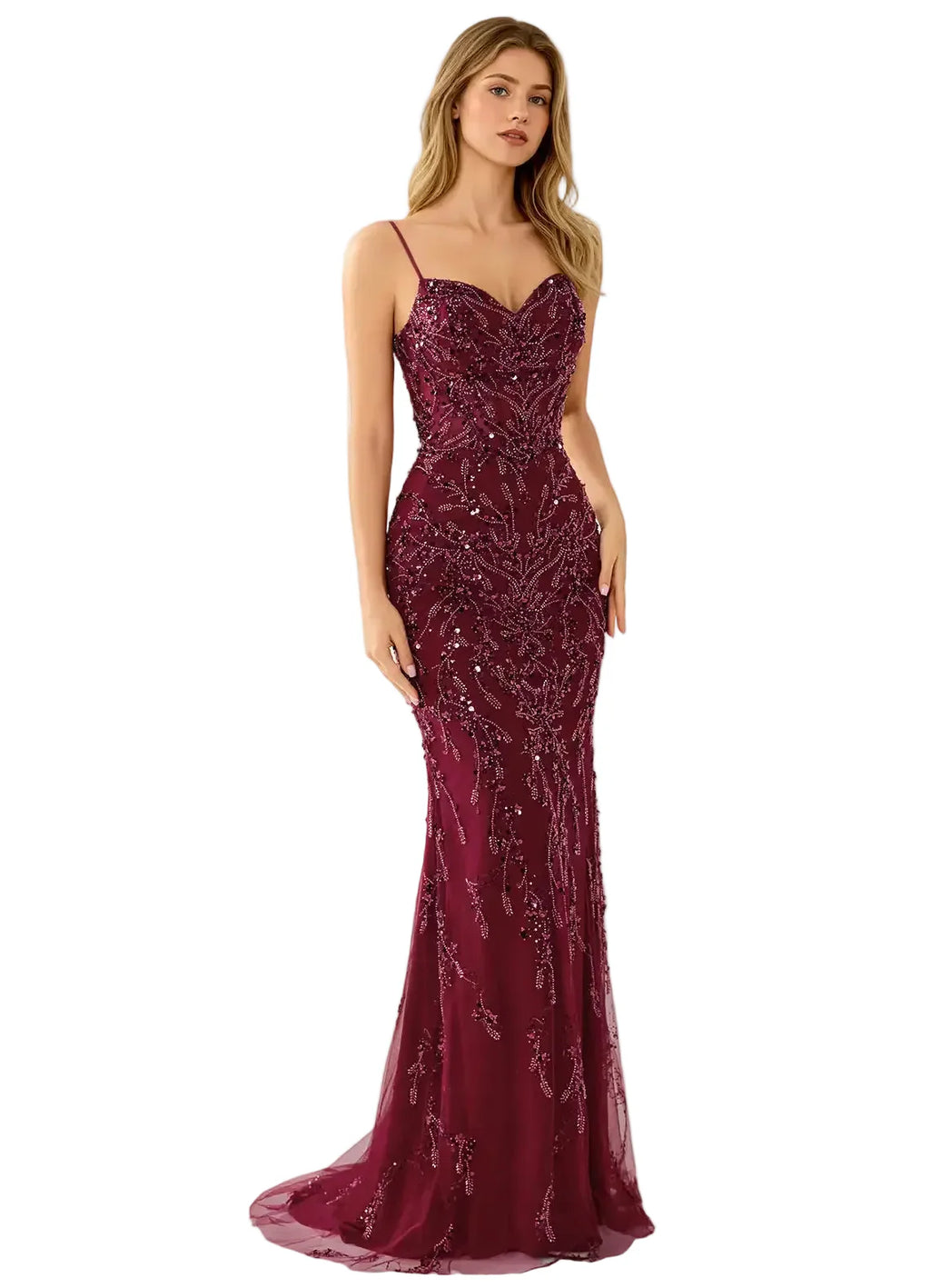 Woman wearing a burgundy evening gown with sequin detailing on a white background